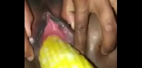  ebony girl gets her pussy stretch with a corn